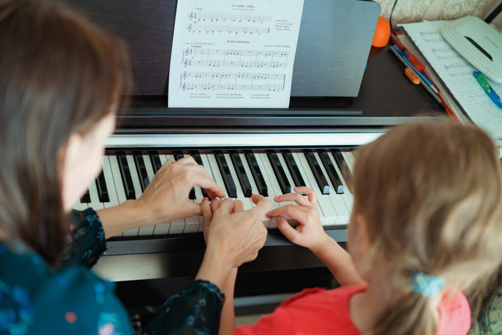 child learning piano